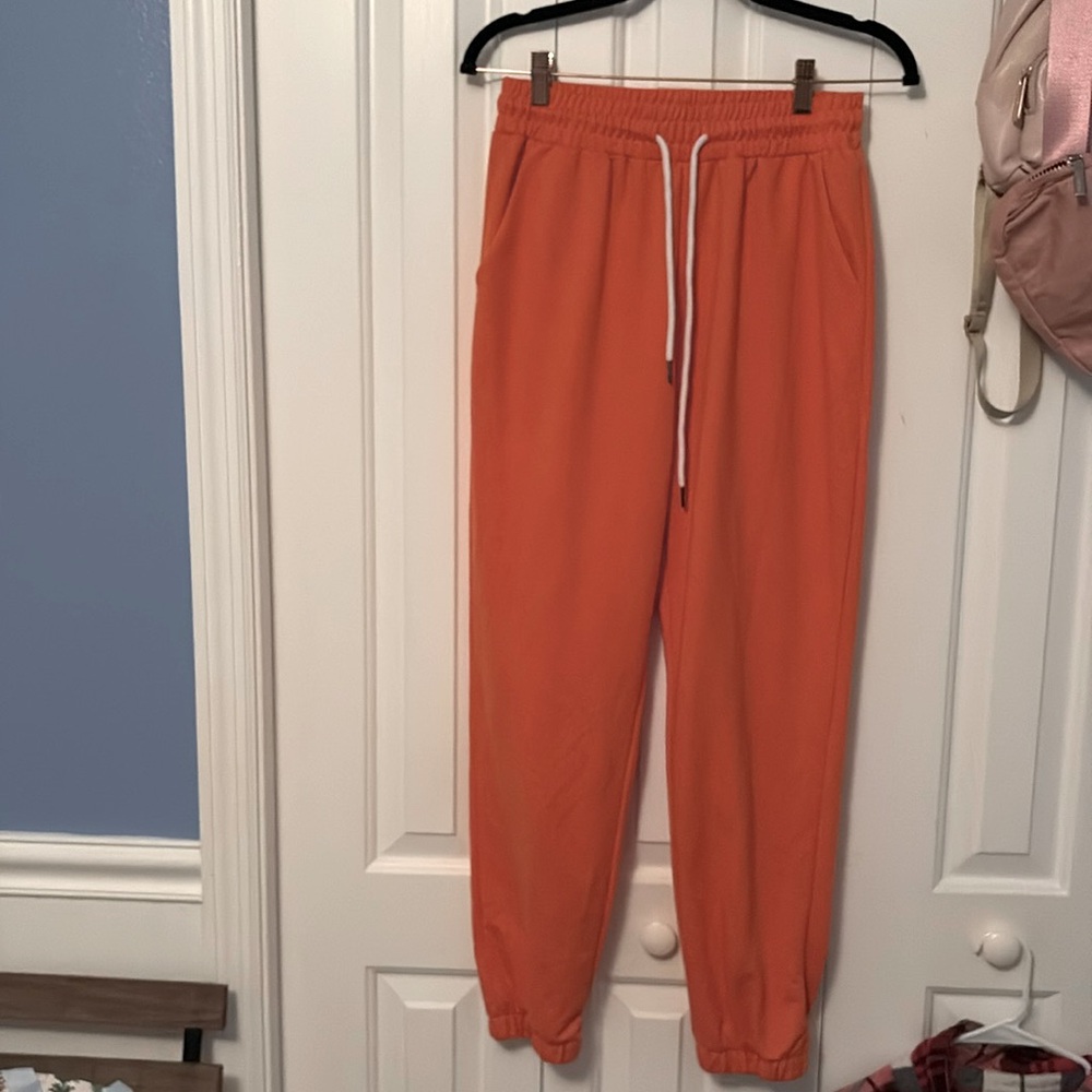 Amazon brand orange sweats size medium, drawstring and comfy.